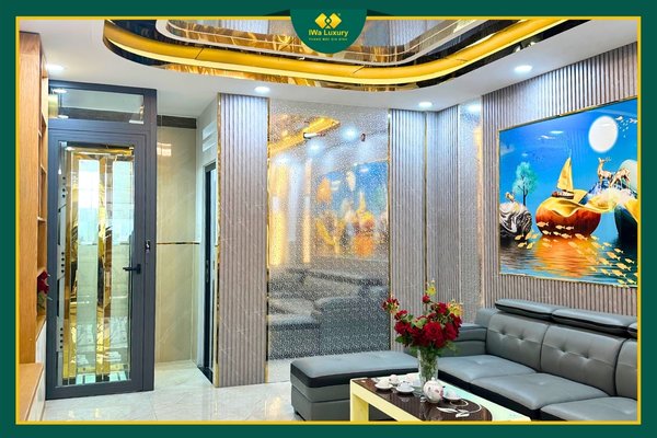 Thang máy gia đình Gò Vấp TP.HCM – cabin inox vàng Rich Gold, vách trống đồng