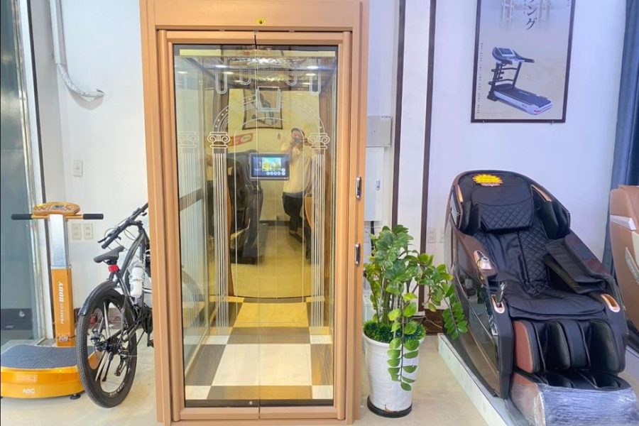 Thang máy mini kính viền vàng